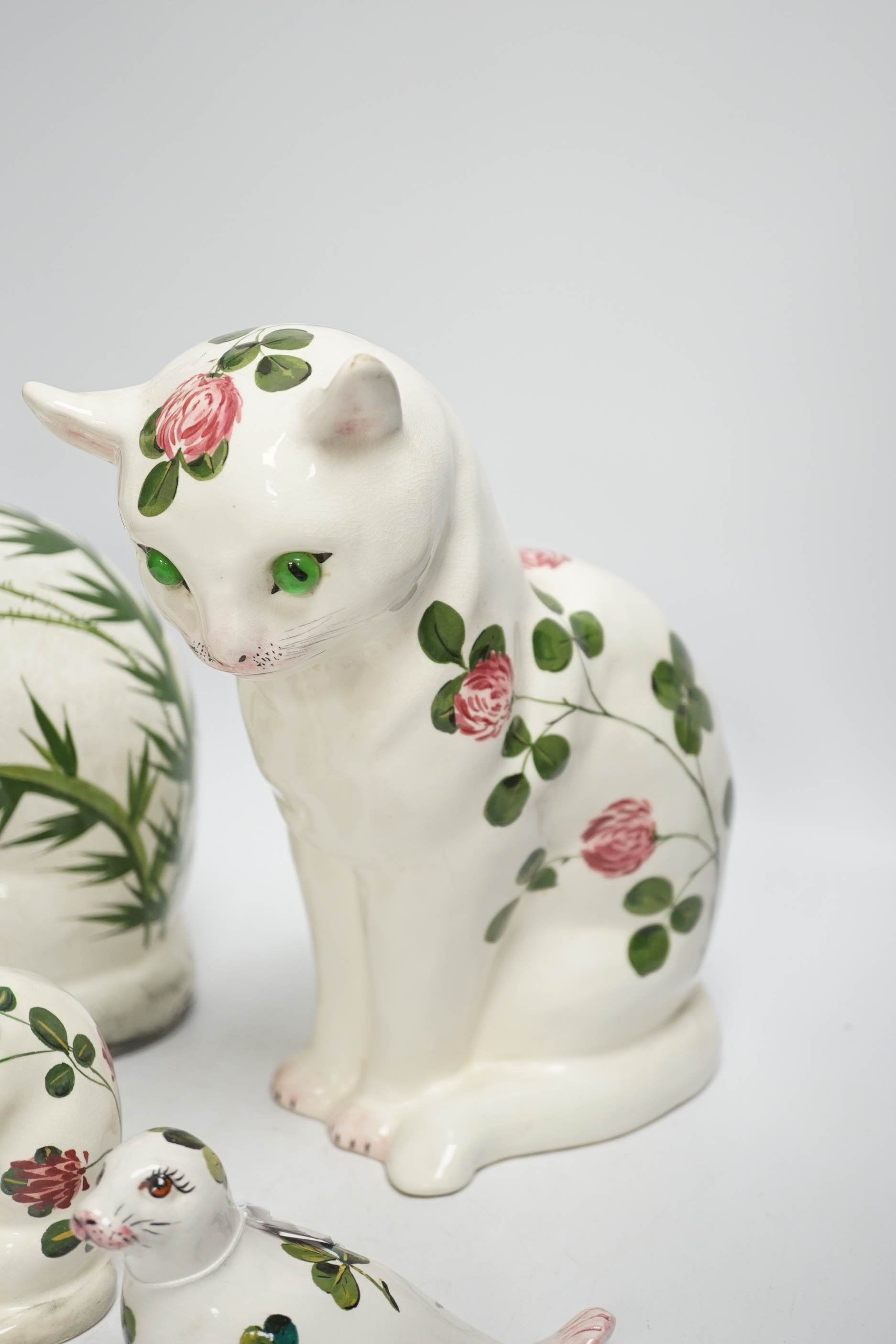 A Plichta clover pattern cat, a Plichta thistle pattern cat, together with two small Plichta cats and a seal, largest 26cm high